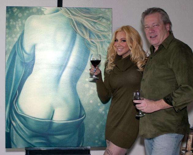 Model Brandy Beavers and artist A.D. Cook with Valhalla painting