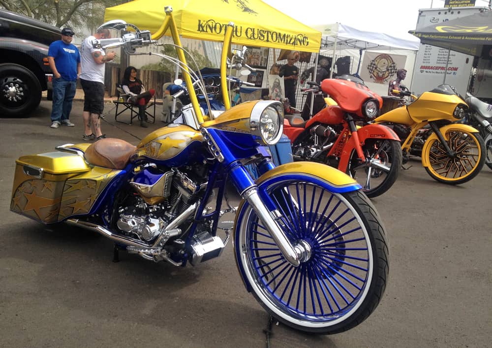 Yellow and blue custom bagger at AZ Bike Week 2014, Cave Creek, AZ