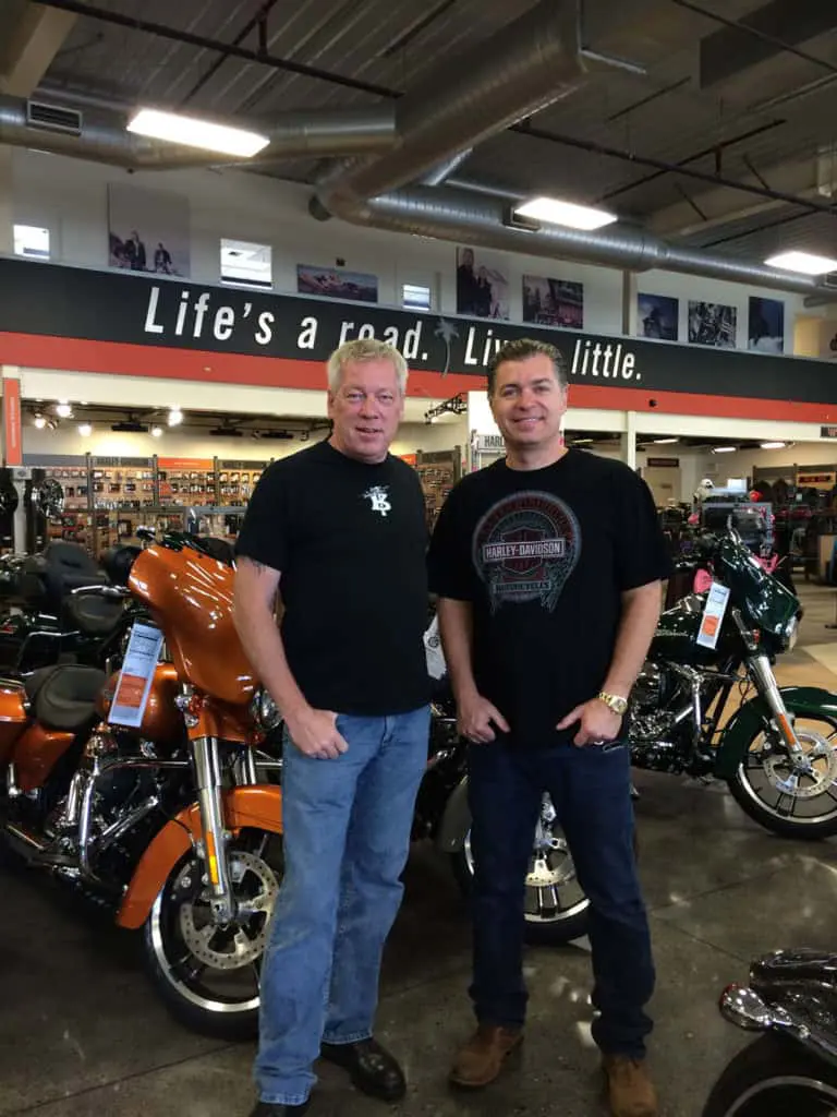 Artist A.D. Cook & collector Ed Wallace at Destination Harley-Davidson