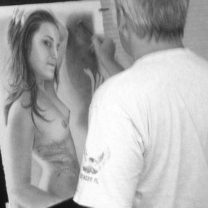 Artist A.D. Cook at the easel drawing DRAGON WITHIN