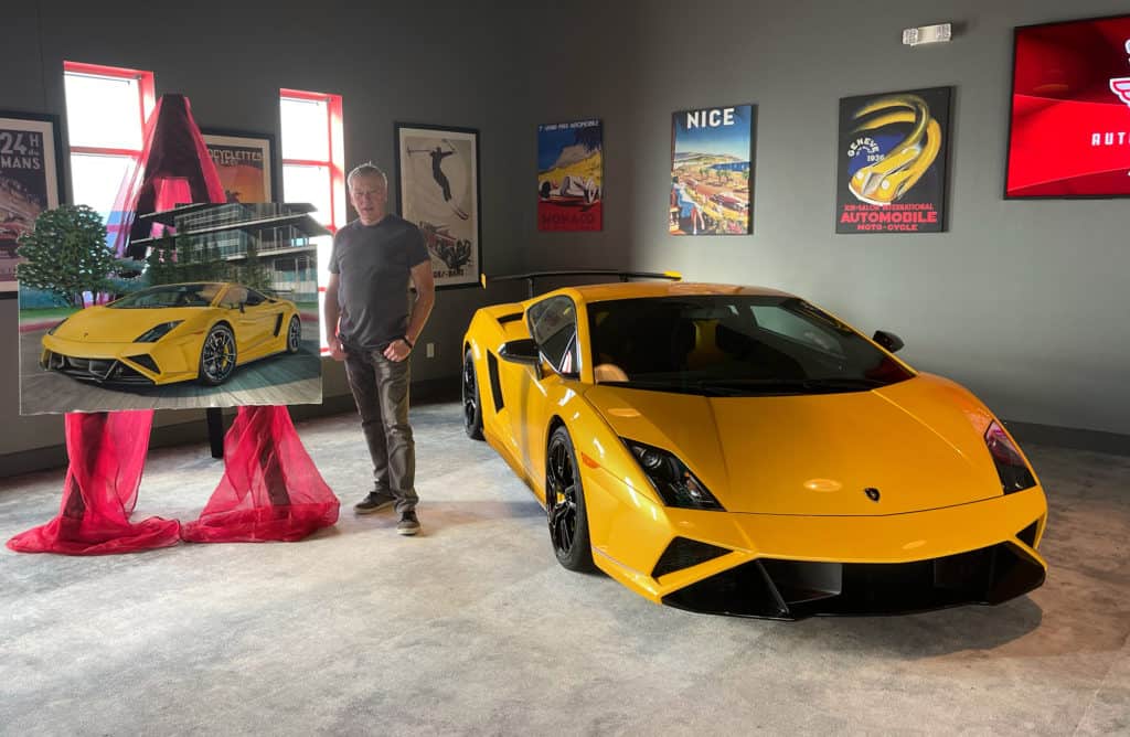 Artist A.D. Cook with Brickyard Bull artwork and Lamborghini at Silo Auto Club