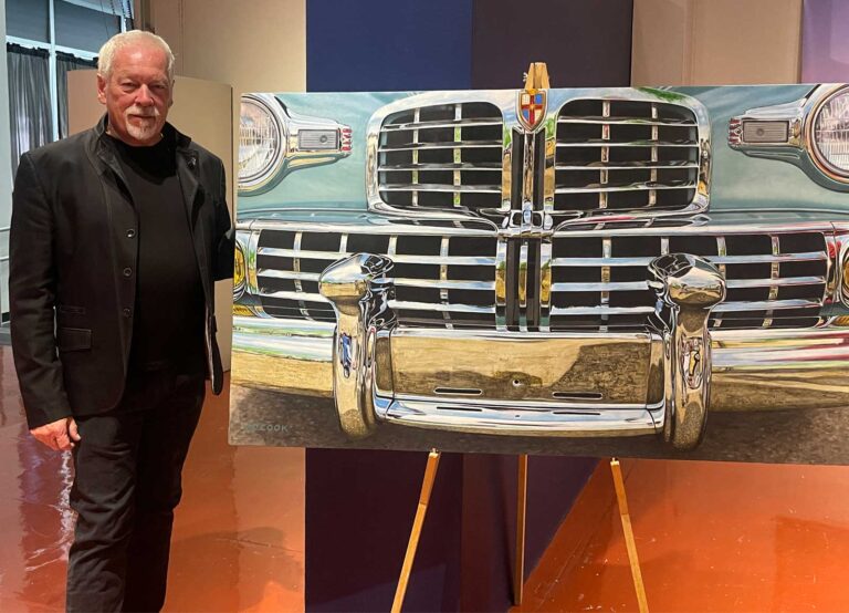 Artist A.D. Cook with CONTINENTAL artwork